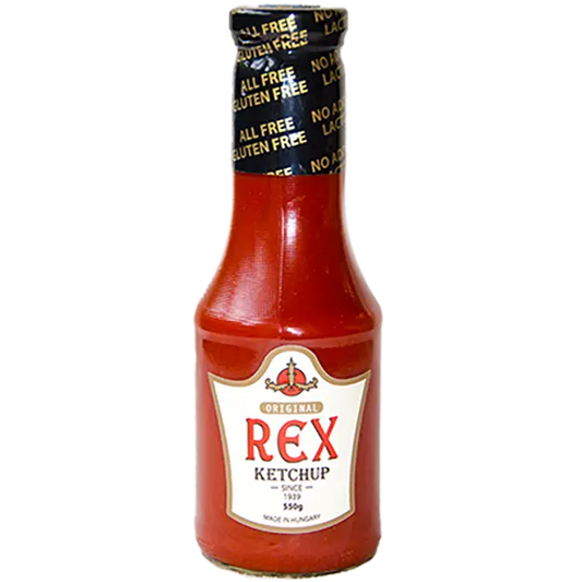 Rex ketchup látható a képen. A címke fehér, a "Rex" szó piros. Az üvegben a ketchup szép, ízléses és piros. A kupak fekete fóilával van lezárva, rajta "All free, gluten free" aranyszínű felirat látható. 